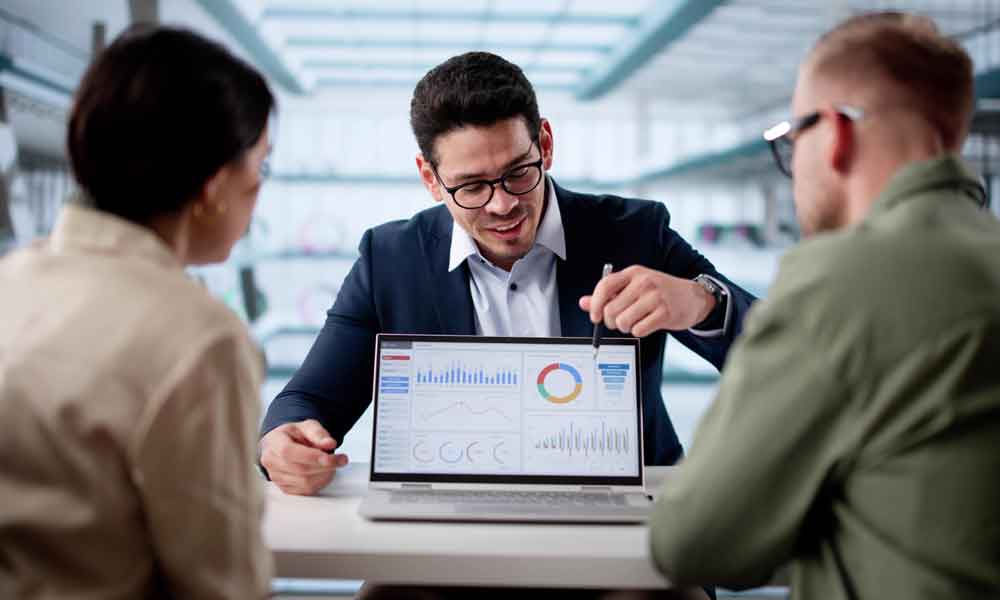 Financial Future Discussion: Couple Meets With Hispanic Planner In Office